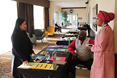 Previous DBE Conference checking guests in